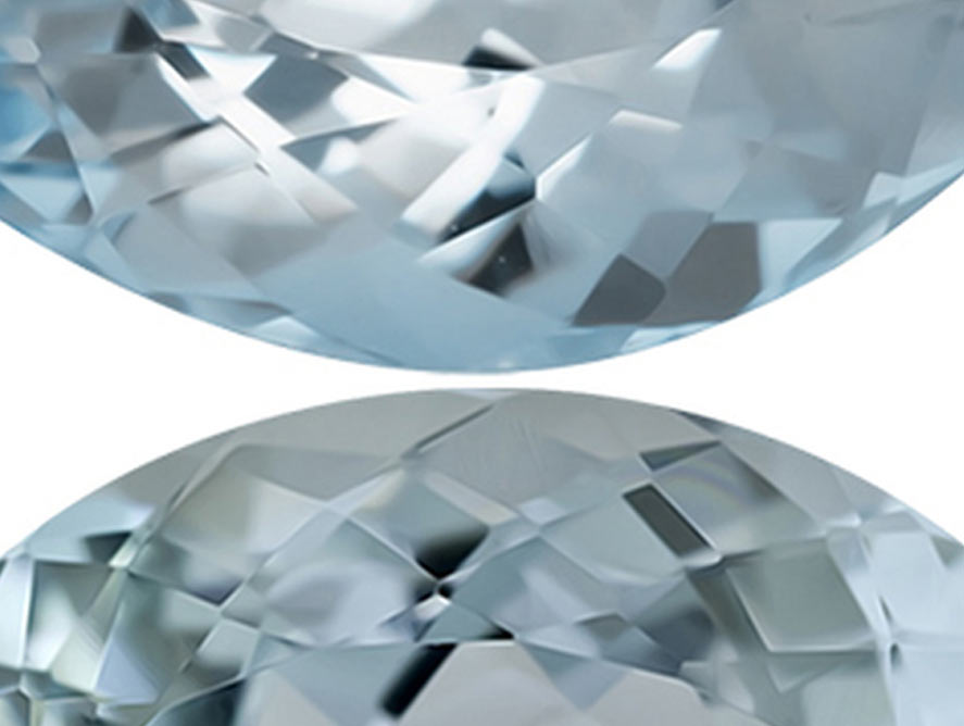 two aquamarine gemstones exhibiting exceptional clarity