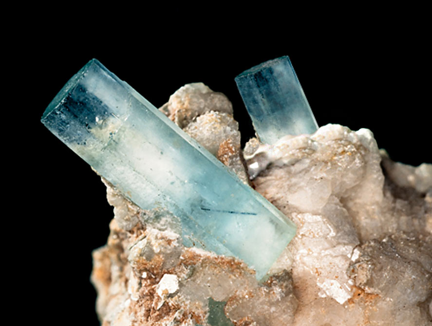 Hexagonal aquamarine crystals terminating in flat top surfaces