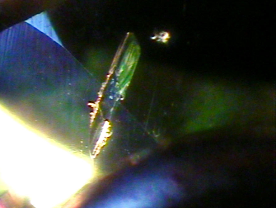 a crystal inclusion inside a tourmaline specimen