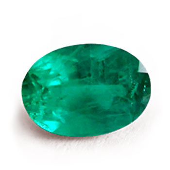 An oval mixed-cut emerald showing a vivid green color