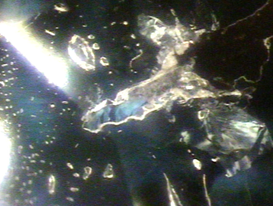 liquid inclusions and crystal inclusions both inside a tourmaline gemstone