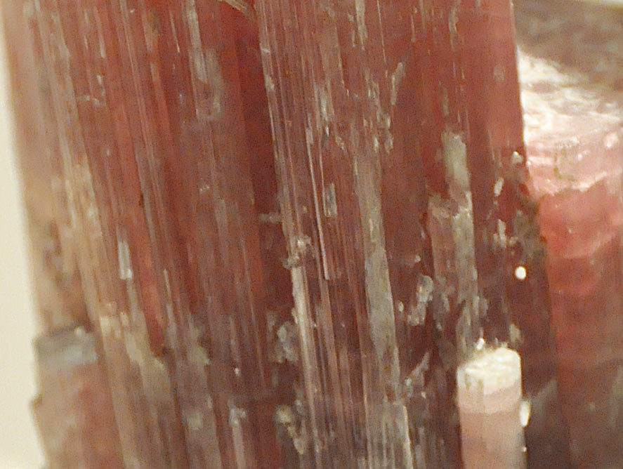 vertical striations on a rough tourmaline crystal